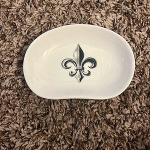 Fleur de lis ceramic jewelry dish.